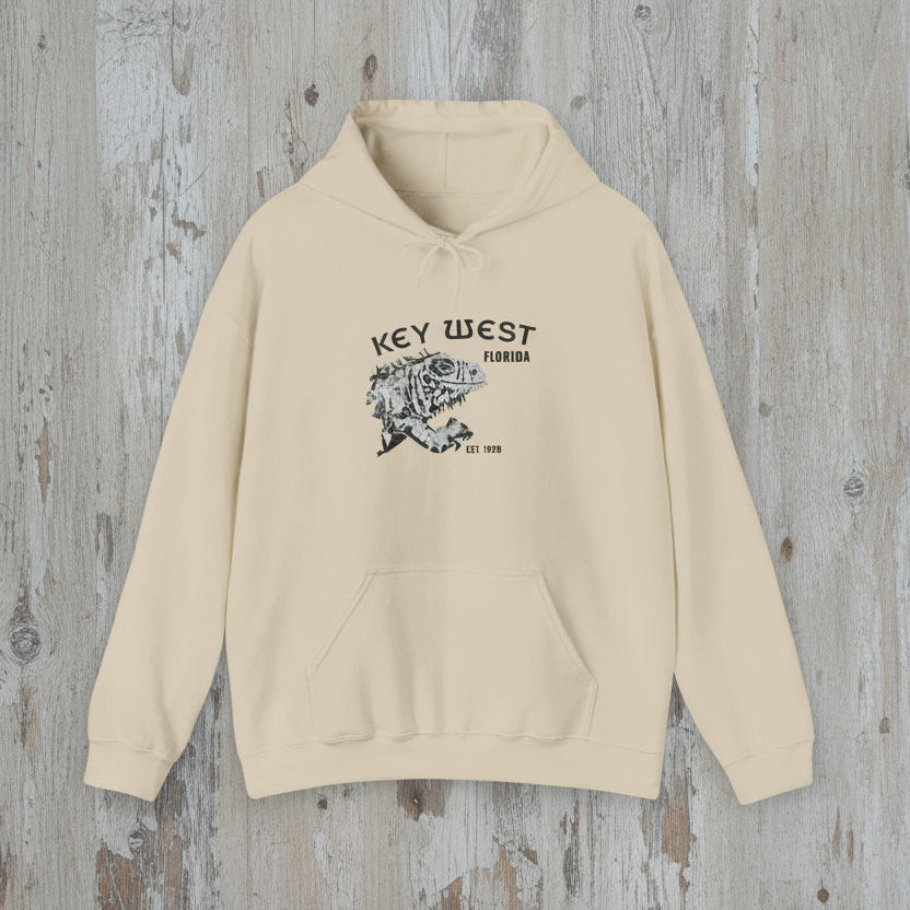 Beige hoodie with 'Key West, Florida' text and graphic on a wooden surface