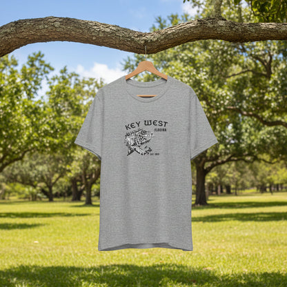 Gray t-shirt with 'Key West' text and graphic on a hanger against a natural background