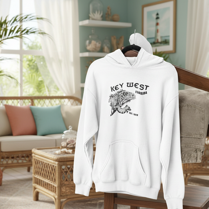 White hoodie with 'Key West' design on a hanger in a living room setting