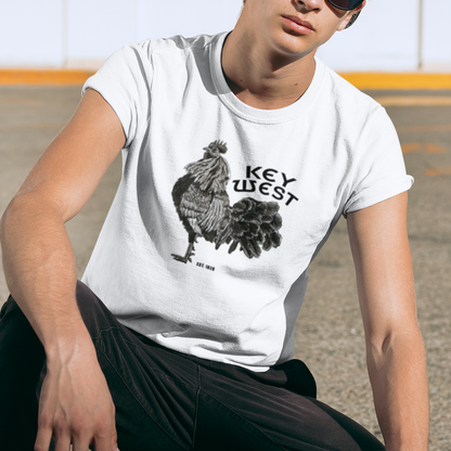 Person wearing a white t-shirt with a rooster graphic and 'Key West' text, sitting outdoors.